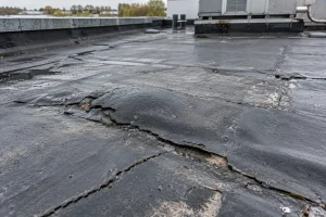 Commercial roof leak repair Liverpool flat roof being inspected